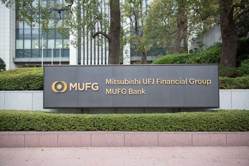 MUFG - Mitsubishi UFJ Financial Group Company sign in front of the Head office in Chiyoda City.