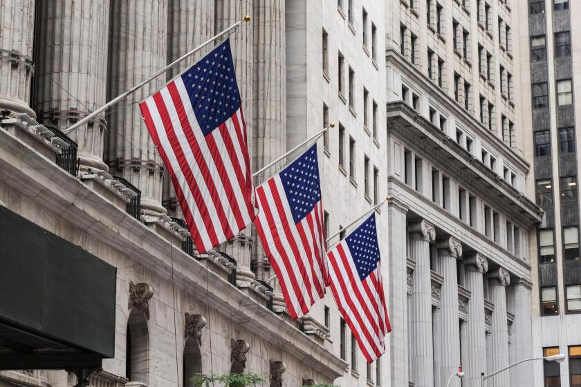 American flags at wallstreet, The New York Stock Exchange on Wall Street, NYC, lower Manhattan, United states.