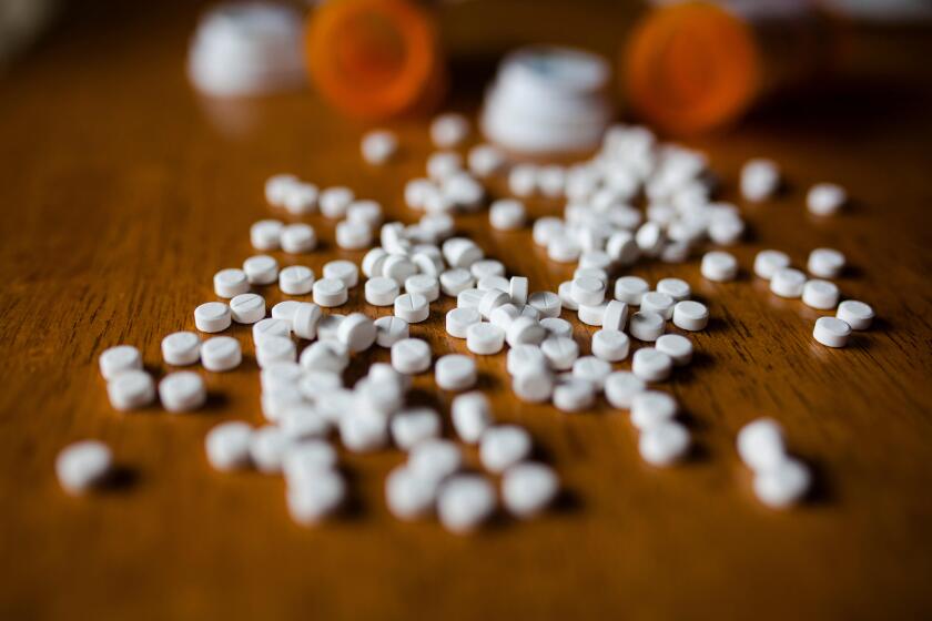 Close-up of pills and bottles on table