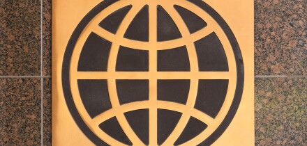 Logo sign of the UN World Bank Group on a granite wall outside a Washington DC office building