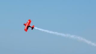 The Oracle stunt biplane climbs into the skies at the 2010 Chicago Air and Water Show.