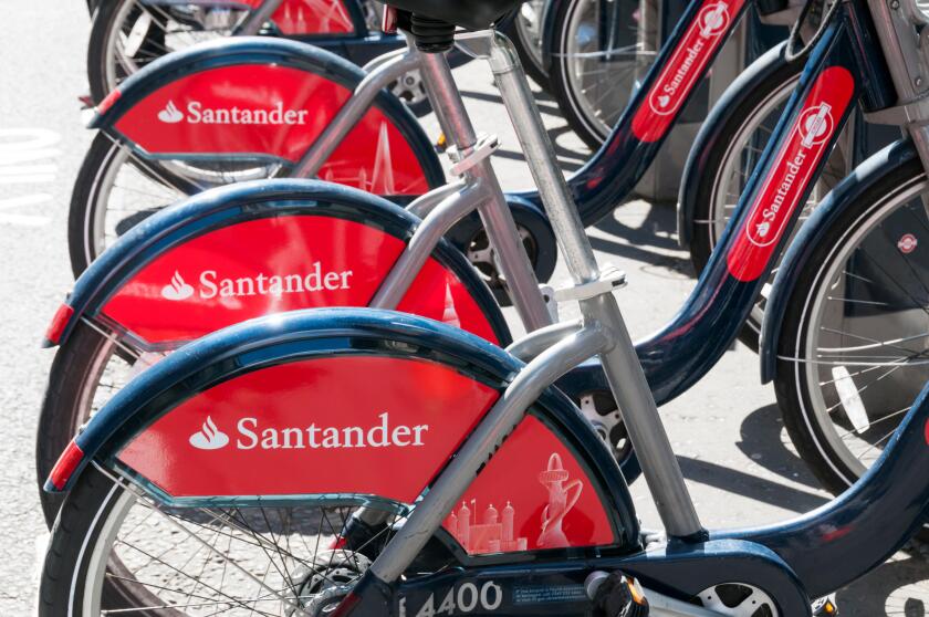 Santander sponsorship on a row of  'Boris Bikes' for hire in London.