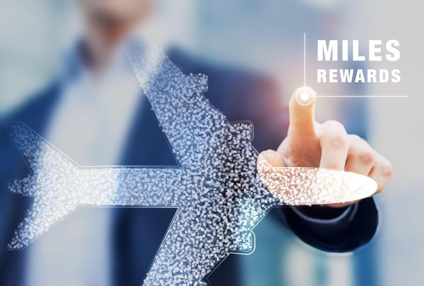 Air miles rewards with person touching airplane shape, frequent flyer loyalty program to earn points and bonuses for travel benefits like elite cards,