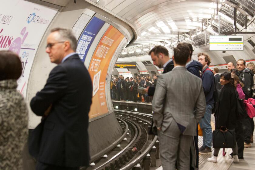 Crowded platform at tube station on London underground tube network London