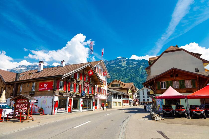 Restaurants in traditional Swiss houses along Hauptstrasse, Matten bei Interlaken, Switzerland