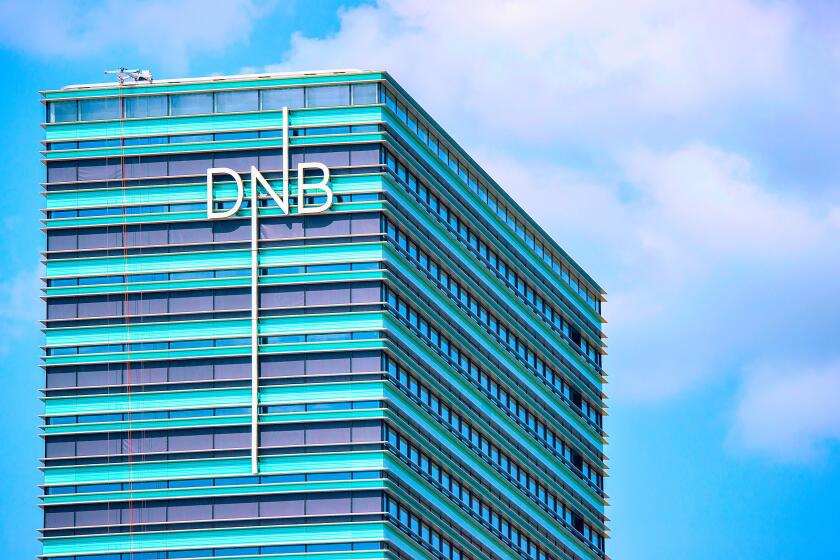 Vilnius, Lithuania - May 6, 2017: Office of DNB bank at modern skyscraper in downtown, Vilnius, Lithuania