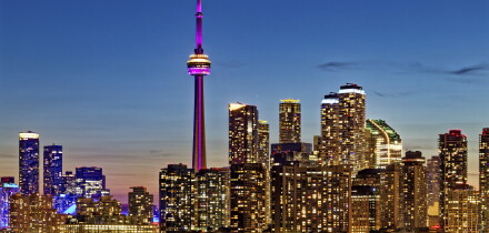 CN Tower dominates skyline of Harbourfront and Downtown Toronto, viewed from Wards Island.