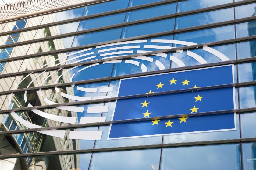 Logo of the European Parliament at the facade of European Parliament building in Leopold Square. August 21, 2015 in Brussels, Be