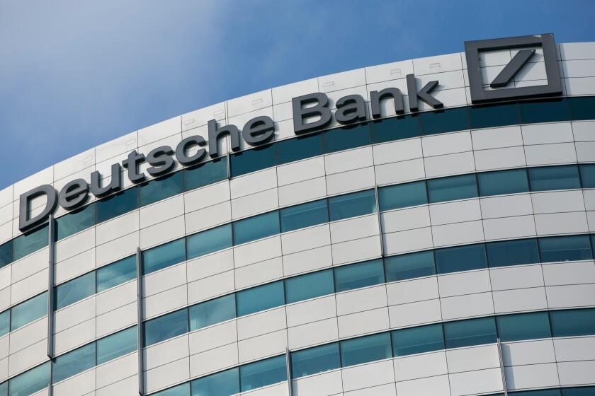 A logo sign outside of an office building occupied by Deutsche Bank in Amsterdam, Netherlands on October 4, 2015.
