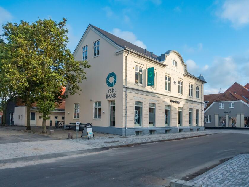 Jyske Bank Facade in Ringkobing Skjern on a sunny summer afternoon