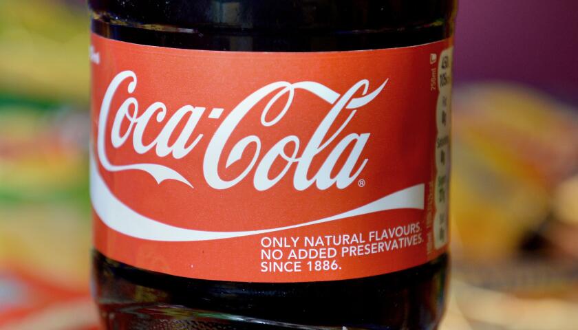 Undated file photo of a bottle of Coca Cola. The Coca-Cola bottling business for the UK and Europe has almost doubled its profits for the past year after it was boosted by the reopening of hospitality and acquisitions. Coca-Cola Europacific Partners (CCEP