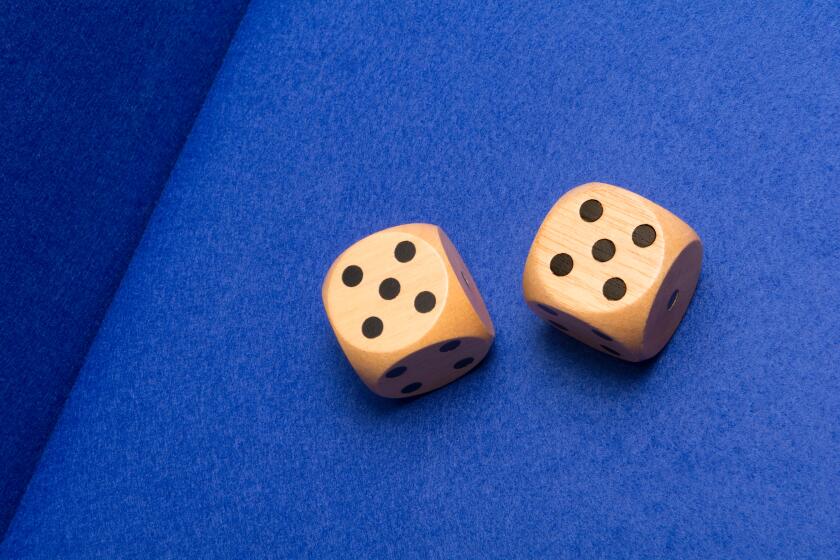 Two gambling dice showing two fives