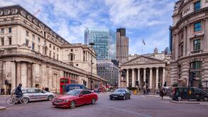 Traffic in Threadneedle Street, London, with the Bank of England, and the Royal Exchange.