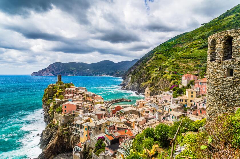 Beautiful view of Vernazza, one of the five famous fisherman villages of Cinque Terre with dramatic cloudscape in Liguria, Italy