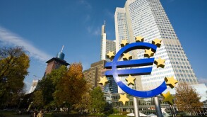 European currency symbol in front of the Eurotower, building of the European Central Bank, ECB, at Frankfurt, Germany