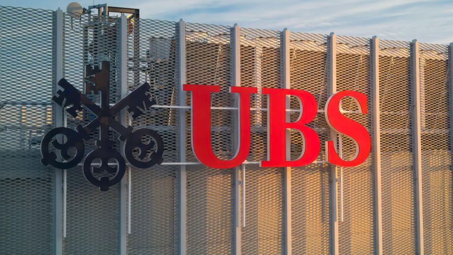 UBS logotype on the top of the UBS office during sunrise. UBS AG is a Swiss global financial services company with its headquarters in Zurich and Base