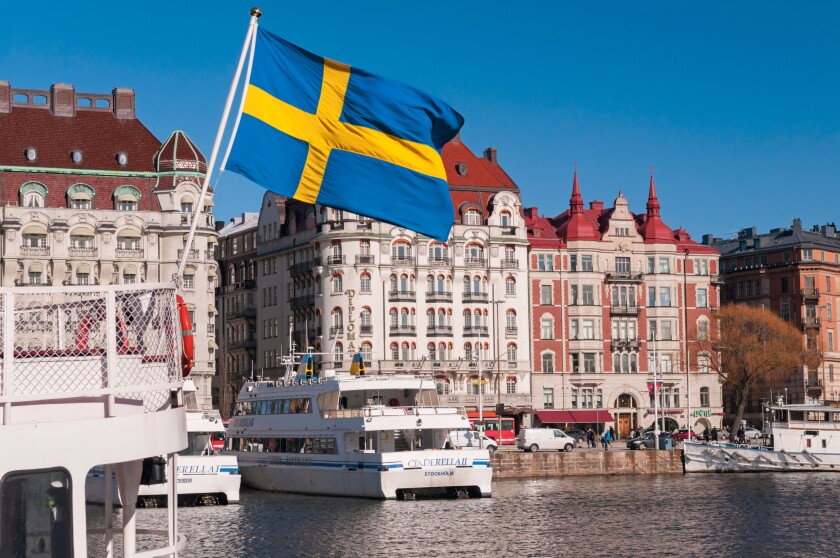 Harbour and Hotel Diplomat. Swedish flag. Ostermalm Stockholm Sweden
