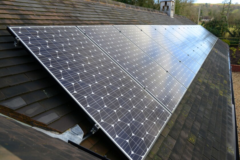 Solar panels on tiled roof Britain Uk