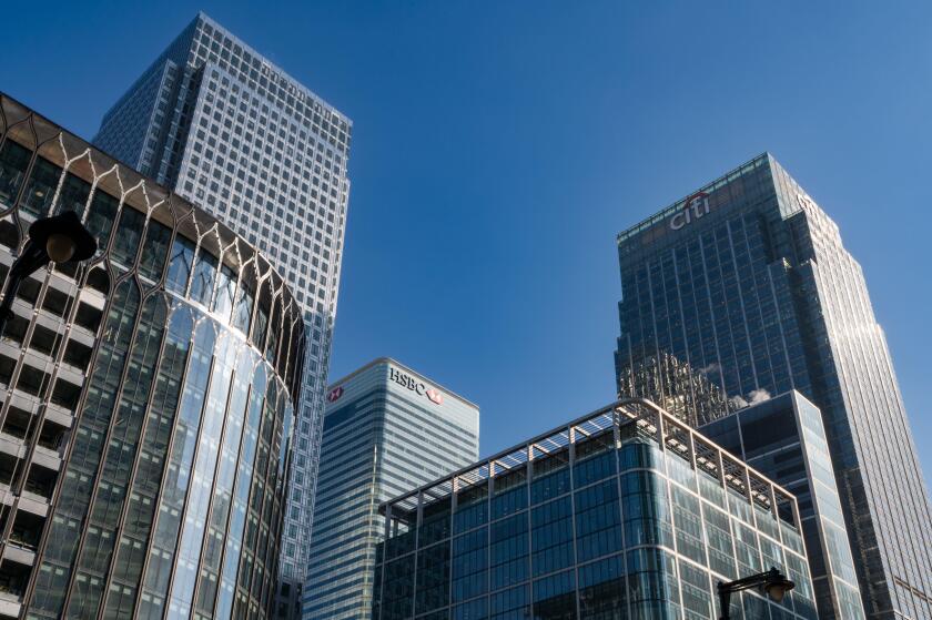 04.04.2023. London, UK. City bank and HSBC skycrapers in Canary Wharf financial district. An investment banks and financial services companies.