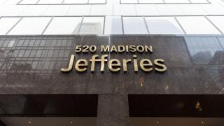 Jefferies Group LLC headquarters entrance sign at 520 Madison Avenue, Midtown Manhattan, New York City, USA