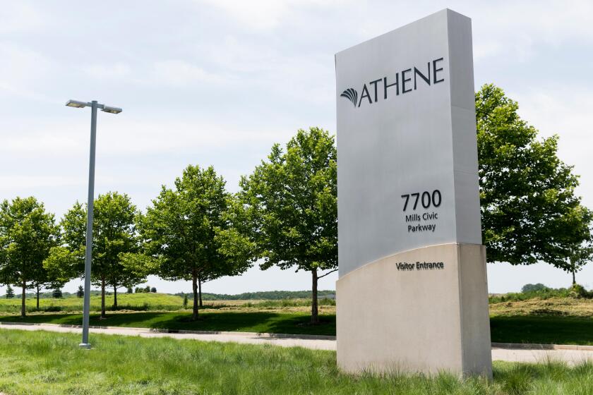 A logo sign outside of a facility occupied by Athene Holding in West Des Moines, Iowa, on June 30, 2018.