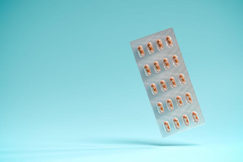 Pills of the drug Molnupiravir in a blister package. Molnupiravir was developed by Merck & Co and is an antiviral Covid-19 therapy. Selective focus