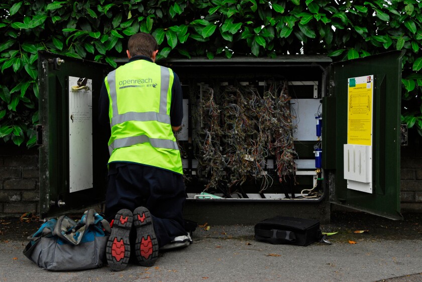 BT Openreach engineer checking telephone lines, Alton, Hampshire, UK.