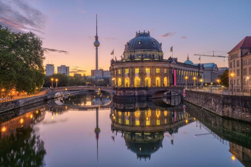 The river Spree in Berlin at dawn with the famous TV Tower and the museum island