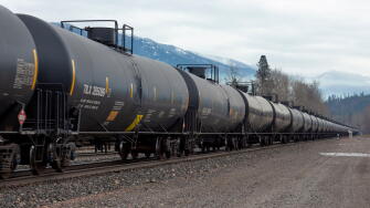 A line of DOT-111 railroad tanker cars, on the tracks at the BNSF train yard, in the town of Troy, Montana

Burlington Northern and Santa Fe Railway w