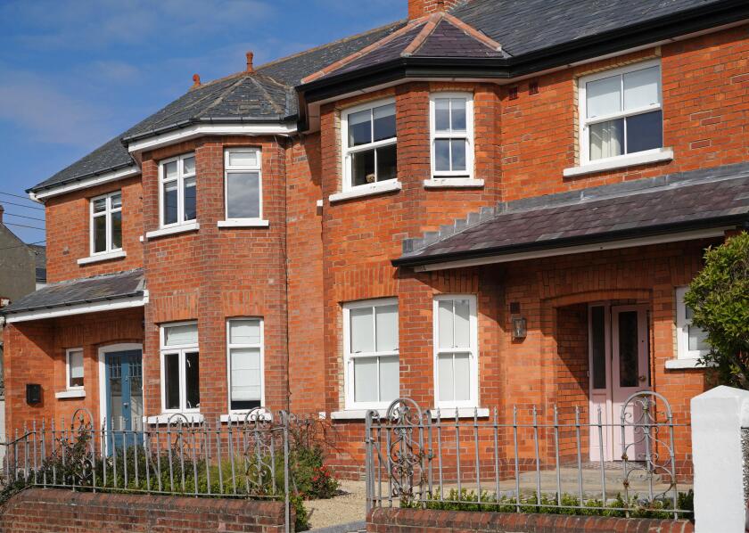 Row of traditional older semi-detached houses