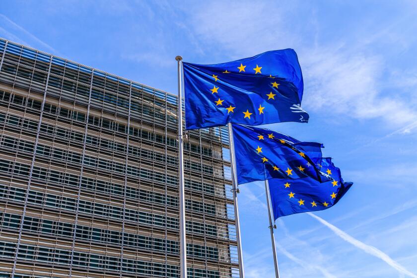 Brussels, Belgium - August 11, 2018: Flags of the European Union in front of the Berlaymont building in Brussels.