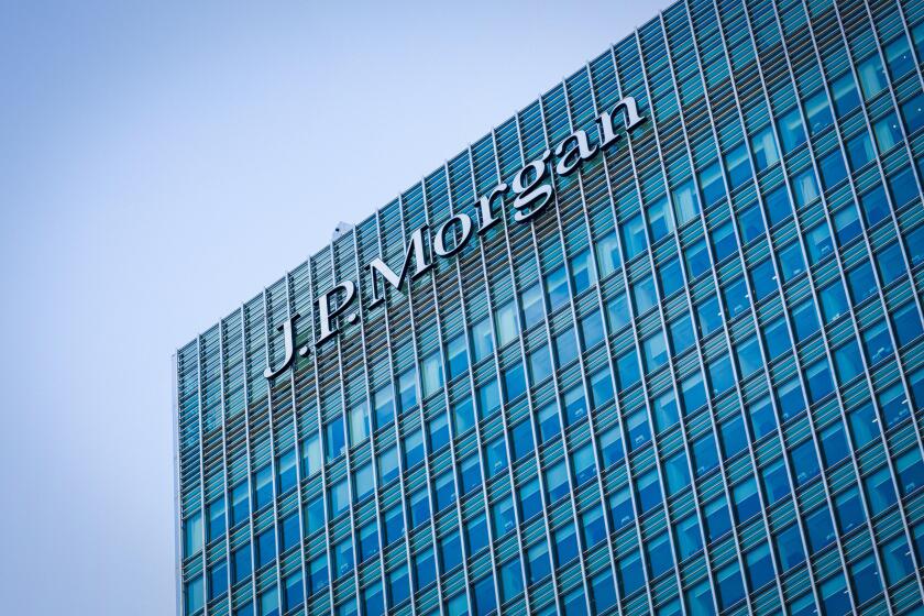 Logo sign of JP Morgan Bank on side of their European Headquarters office building in Canary Wharf, Docklands, London