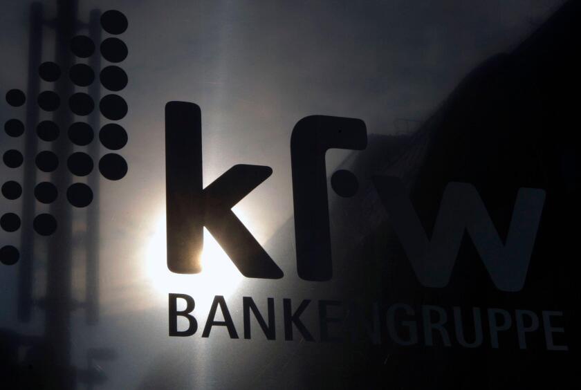 The sun is reflected in the logo of the state development KfW bank in Berlin September 17, 2008. Germany's Finance Ministry wants an explanation as to why state lender KfW transferred 300 million euros ($426 million) to Lehman Brothers on the day the U.S.