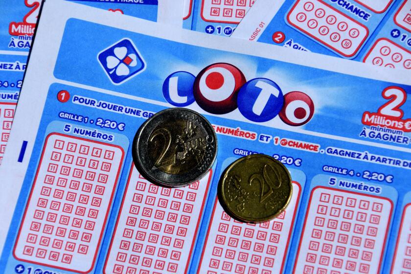 In this photo illustration, coins seen on Lotto tickets.
La Francaise des Jeux celebrated the 45th anniversary of its flagship lottery on May 19, 2021, with a super jackpot of 13 million euros. (Photo by Gerard Bottino / SOPA Images/Sipa USA)