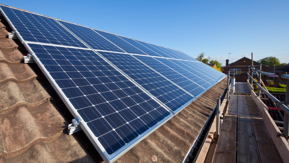 solar panels being installed on house roof england uk gb europe solar panels on roof uk