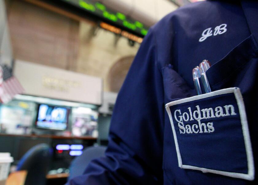A trader works at the Goldman Sachs stall on the floor of the New York Stock Exchange, April 16, 2012.  REUTERS/Brendan McDermid/File Photo