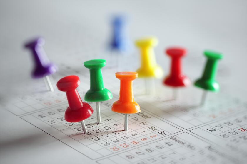 Thumbtack in calendar concept for busy, appointment and meeting reminder