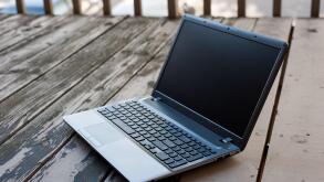 Laptop on the wooden table