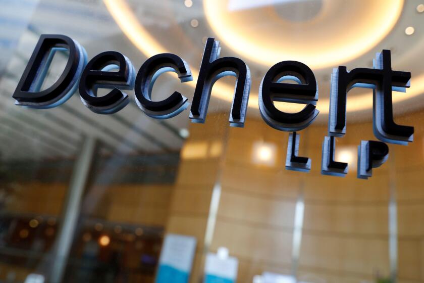 Signage is seen outside of the law firm Dechert LLP in Washington, D.C., U.S., August 30, 2020. REUTERS/Andrew Kelly