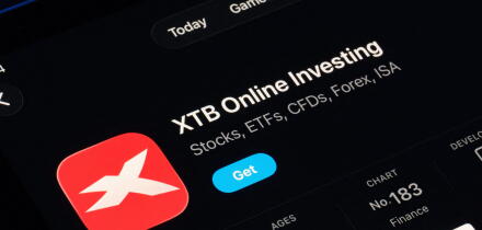 XTB Online Investing listing captured on iPad, Apple Liquid Glass look in iOS 26 highlights refreshed UI and typography. Stafford, United Kingdom, Sep