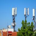 Mobile phone masts above rooftops, Fethiye, Turkey