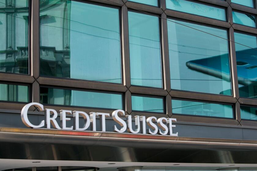 A logo sign outside of a facility occupied by the Credit Suisse Group in Milan, Italy on September 3, 2016.