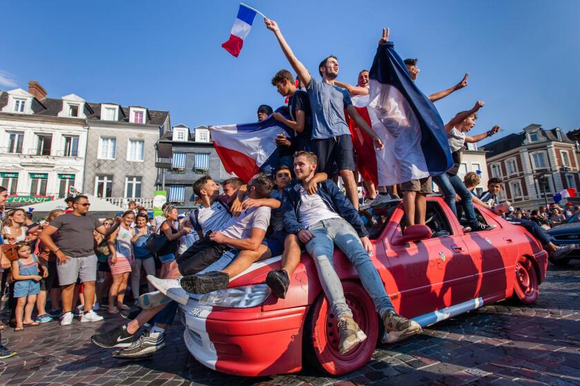 France, Eure, Risle Valley, Pont-Audemer, labeled the Most Beautiful Detours of France, nicknamed the Little Venice of Normandy, supporters of the French football team celebrate victory at the 2018 World Cup