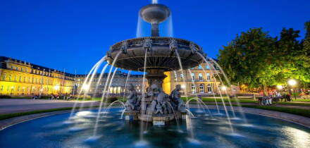 Stuttgart Schlossplatz with fountain and Neues Schloss travel by night in Germany