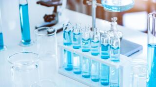 Laboratory test tubes and solution with stethoscope background. Science and Medical concept. Scientist research and analysis biotechnology concept