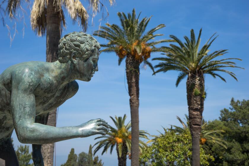 A statue of 'The Runner' in the garden of Achilleion in Corfu palace
