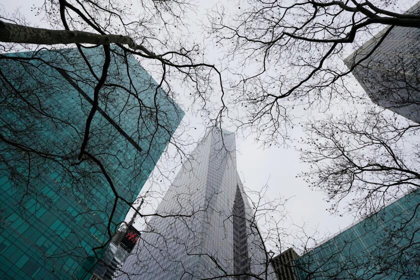 The Bank of America Tower and the 1095 Avenue of the Americas building seen between bare treetops of the Bryant Park. Midtown Manhattan, NYC, NY, USA