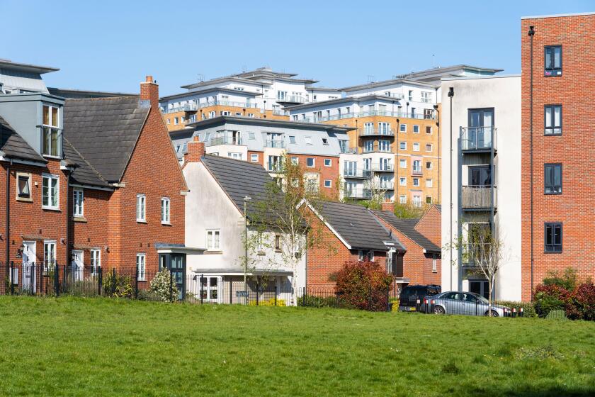 Mixed terraced houses, semi detached housing and flats at Sinclair Drive and Winterthur Way in Basingstoke town centre, Basingstoke, Hampshire, UK