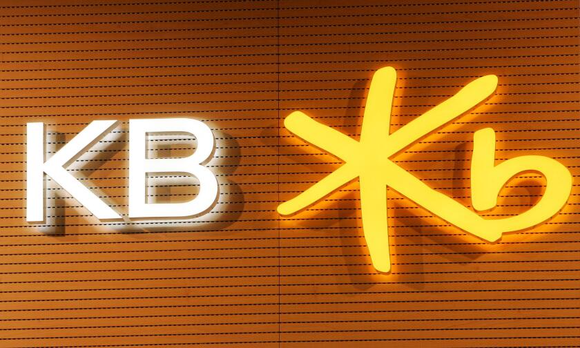 The logo of KB Financial Group is pictured during the company's annual shareholder meeting at its headquarters in Seoul March 27, 2009.  KB Financial is the holding firm of South Korea's top retail bank, Kookmin Bank.  REUTERS/Jo Yong-Hak (SOUTH KOREA BUS