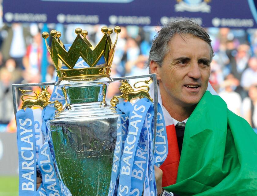 Roberto Mancini manager of Manchester City with the 2012 Barclays Premier League trophy .Barclays Premier League match Manchester City v QPR at the Etihad Stadium, Manchester on the 13th May 2012.Pic Simon Bellis/SPORTIMAGE. (Cal Sport Media via AP Images)